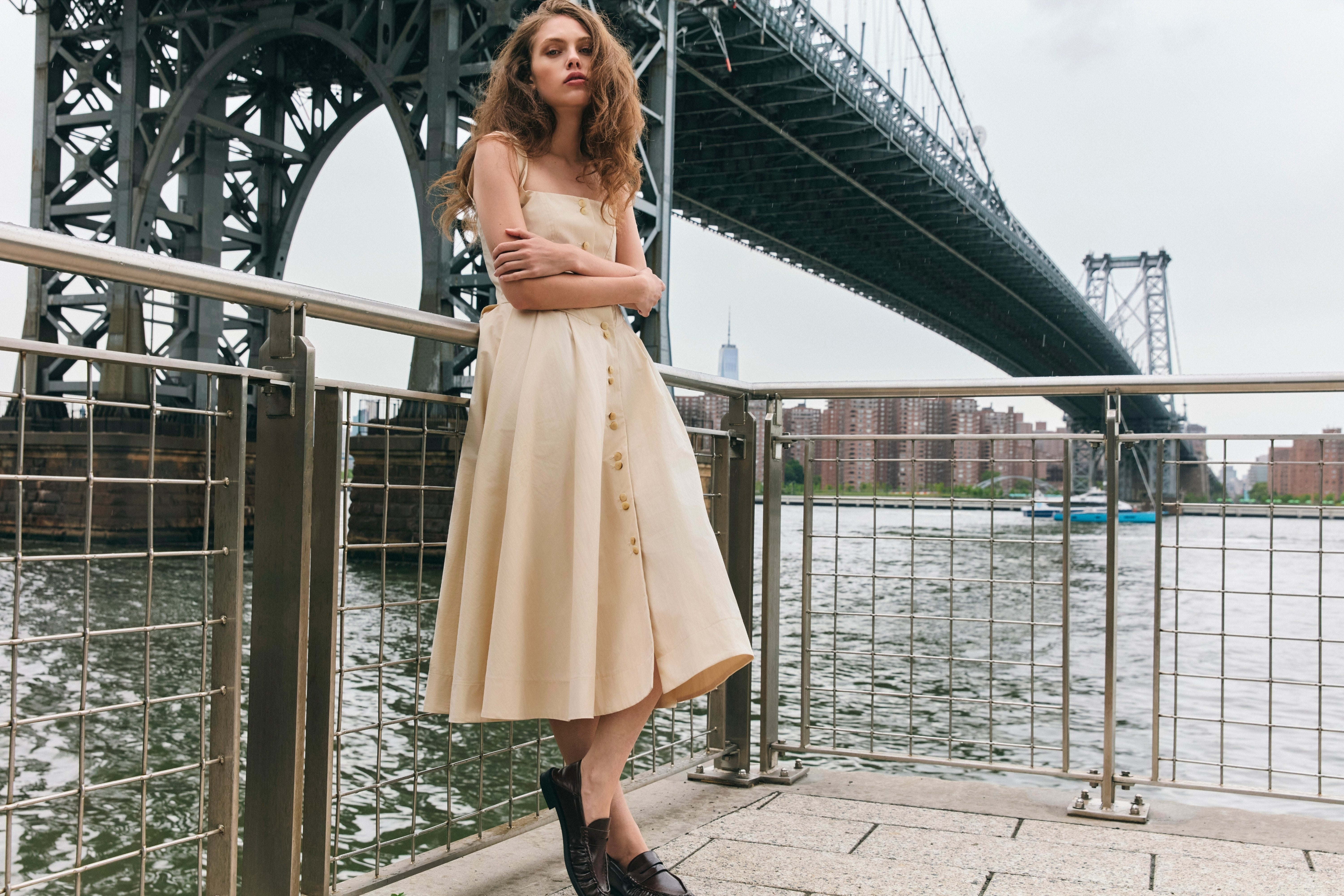 Stathe SS26 campaign — Toloache dress in Powder, lifestyle editorial on Williamsburg Bridge, NYC