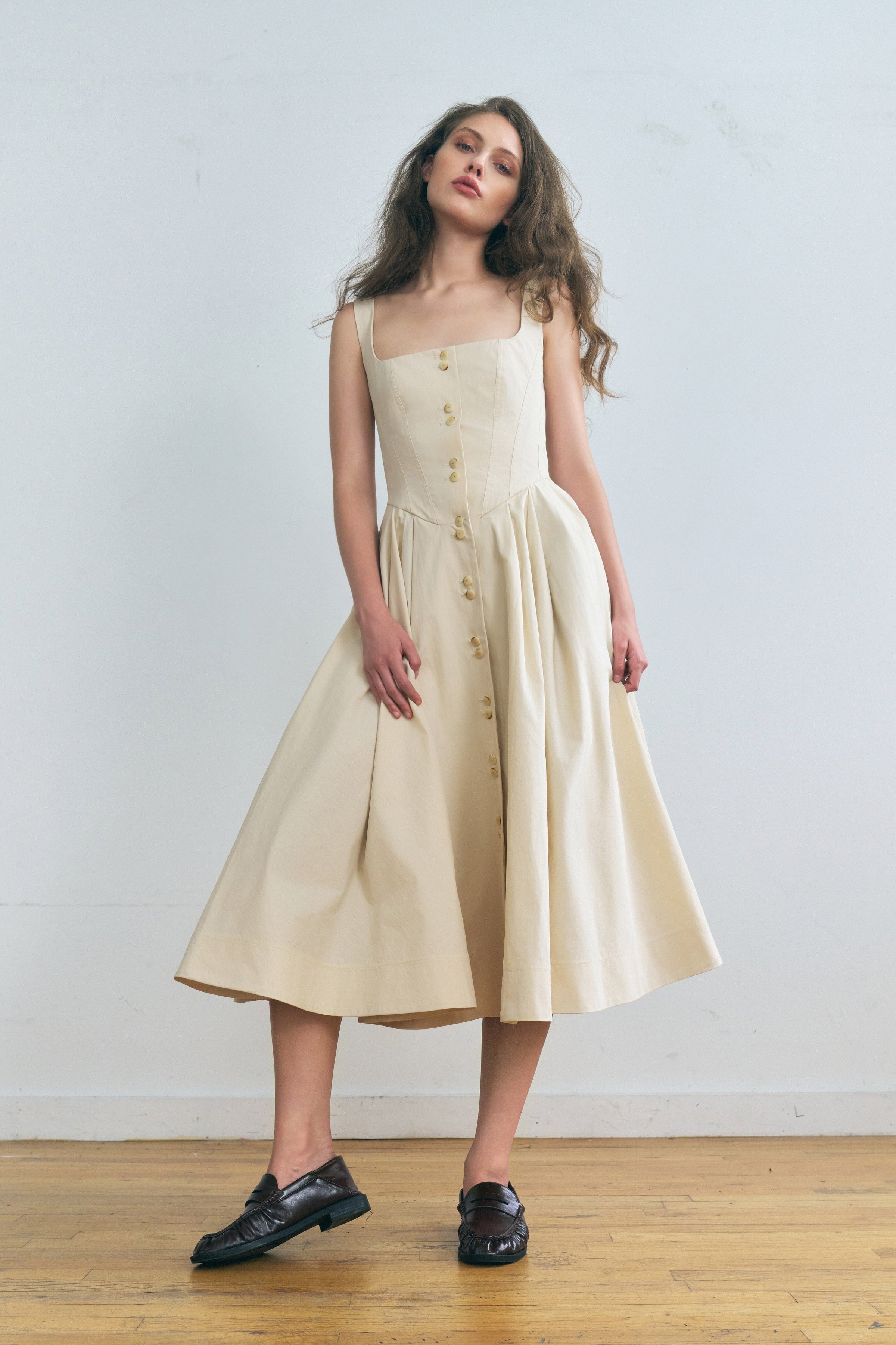Toloache dress in Powder — Premium Japanese Cotton Blend, seamed bustier bodice, full A-line skirt, Italian carozo natural buttons, concealed back zipper closure, full-length front view