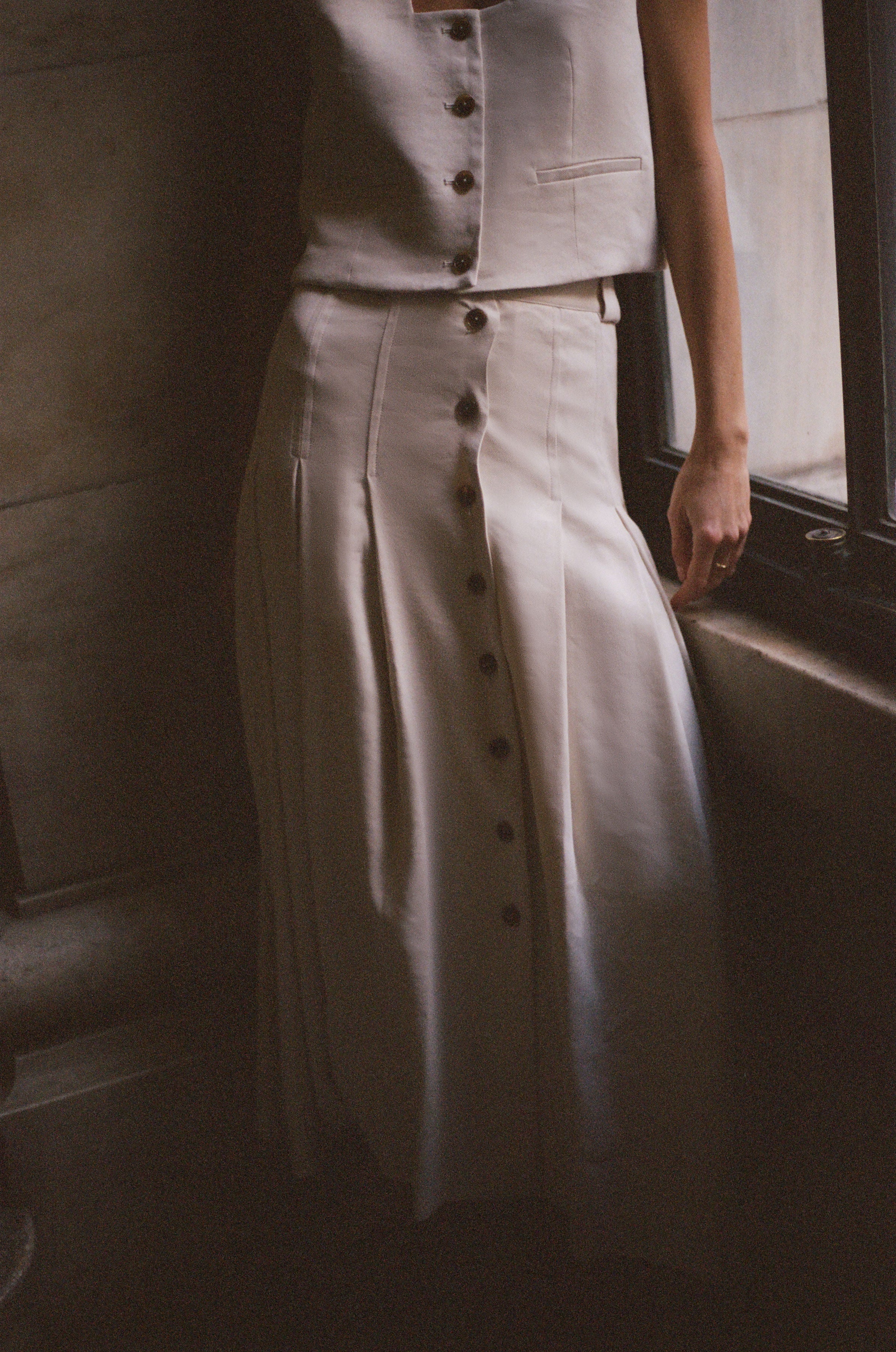 Ambrosia skirt in Alabaster — Italian linen twill, top-stitched front and back pleats, horn-style front buttons, comfortable waistband, ankle length, silk lining