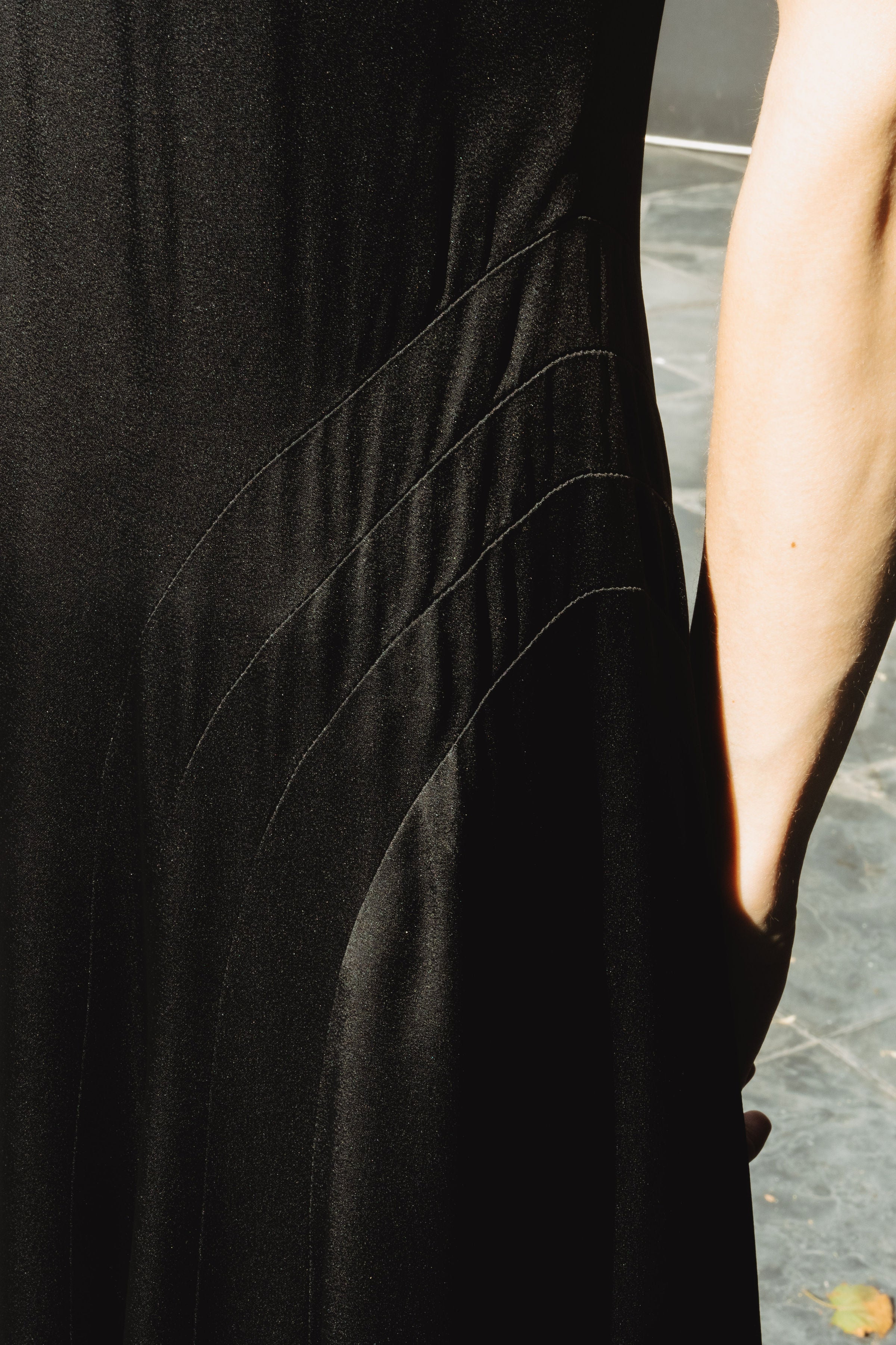 Ceiba Dress in Black — lustrous crepe back satin, sheer silk organza details, below-ankle length, side zip closure, elegant drape, fabric detail