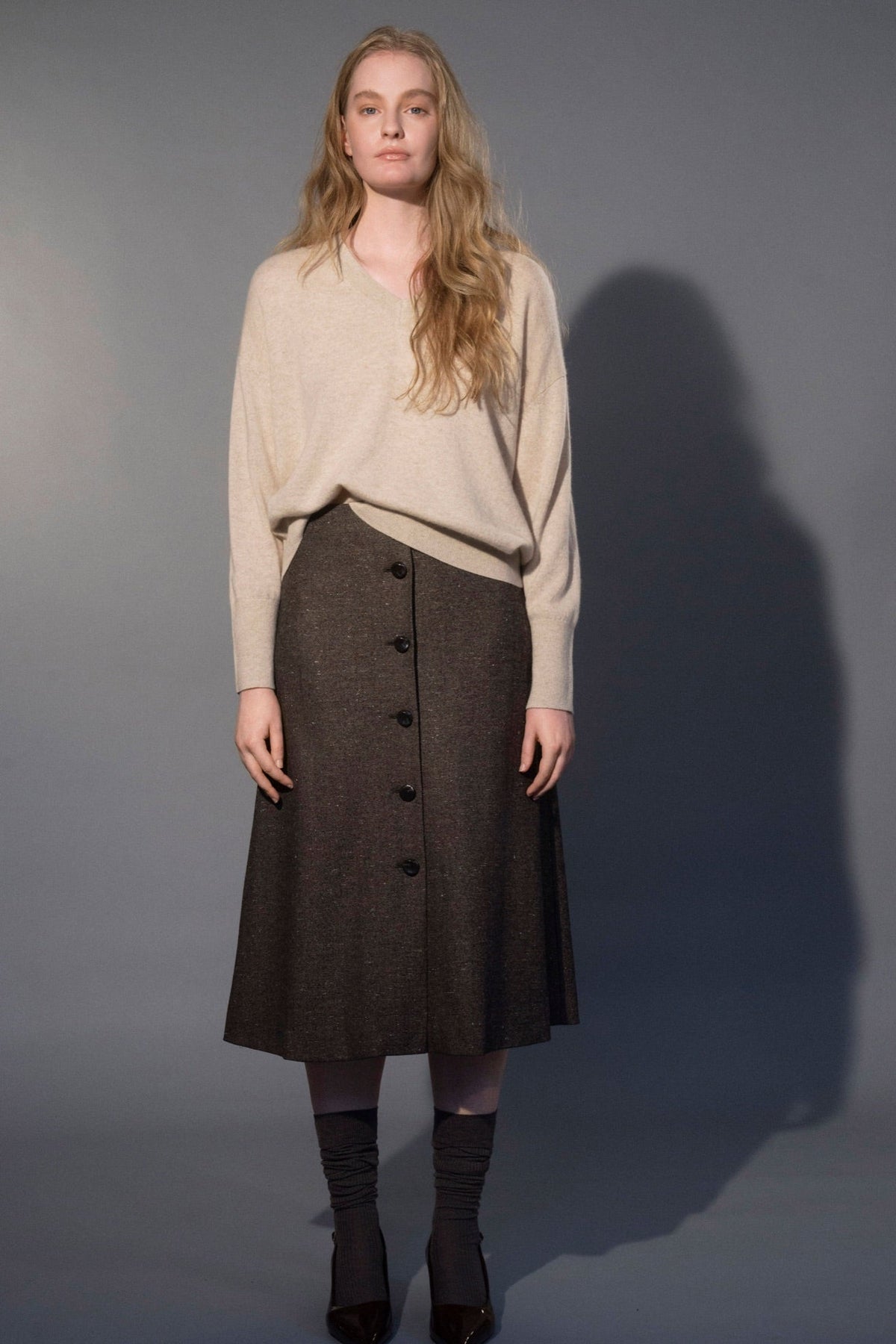 Woman wearing the Stathe Guacaporo Skirt in Speckled Truffle — editorial