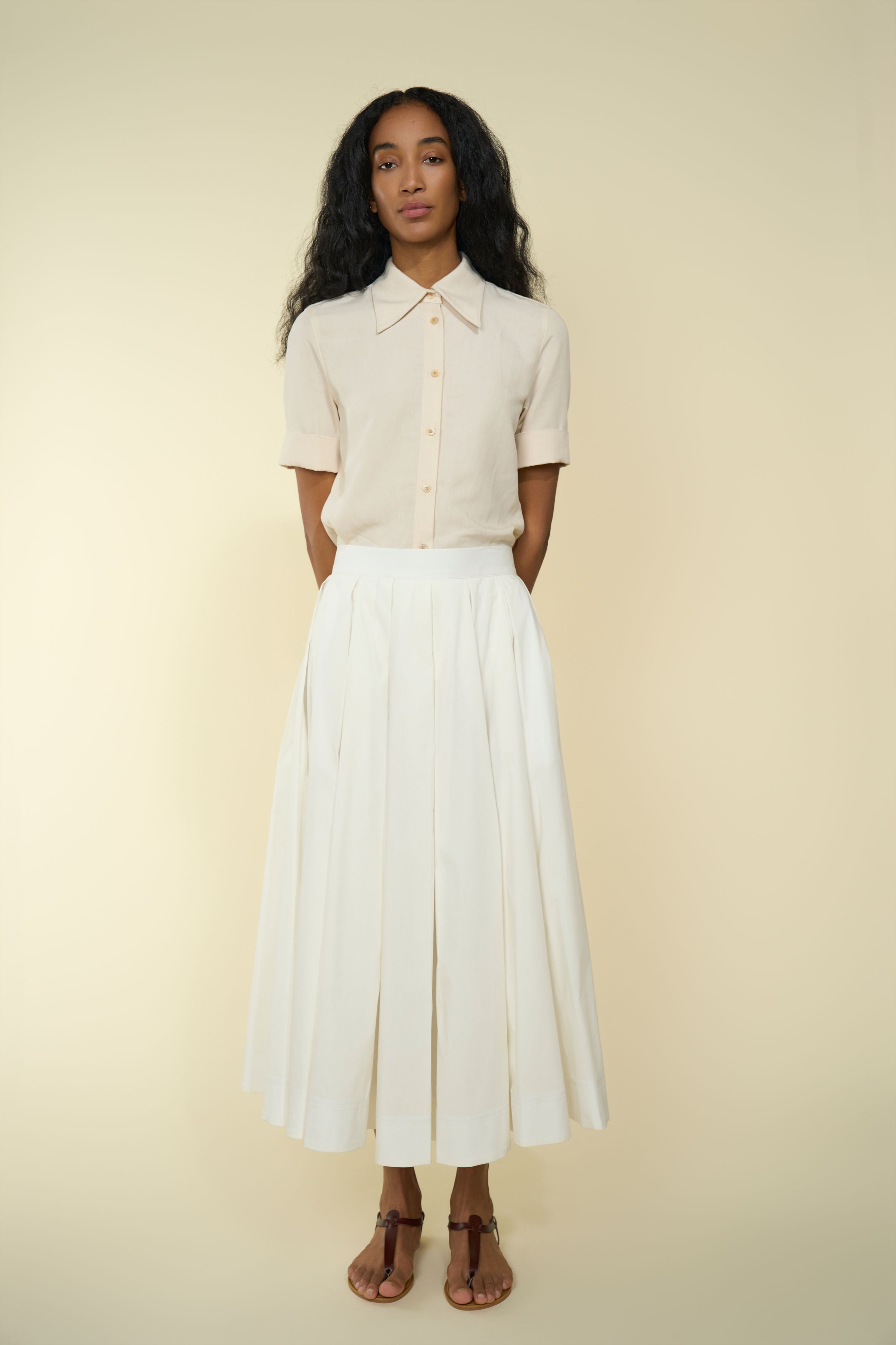 Lightweight Palofierro skirt in White — Japanese cotton, natural waist, above-ankle length, hidden back-zip and button closure, hidden side pockets, side view