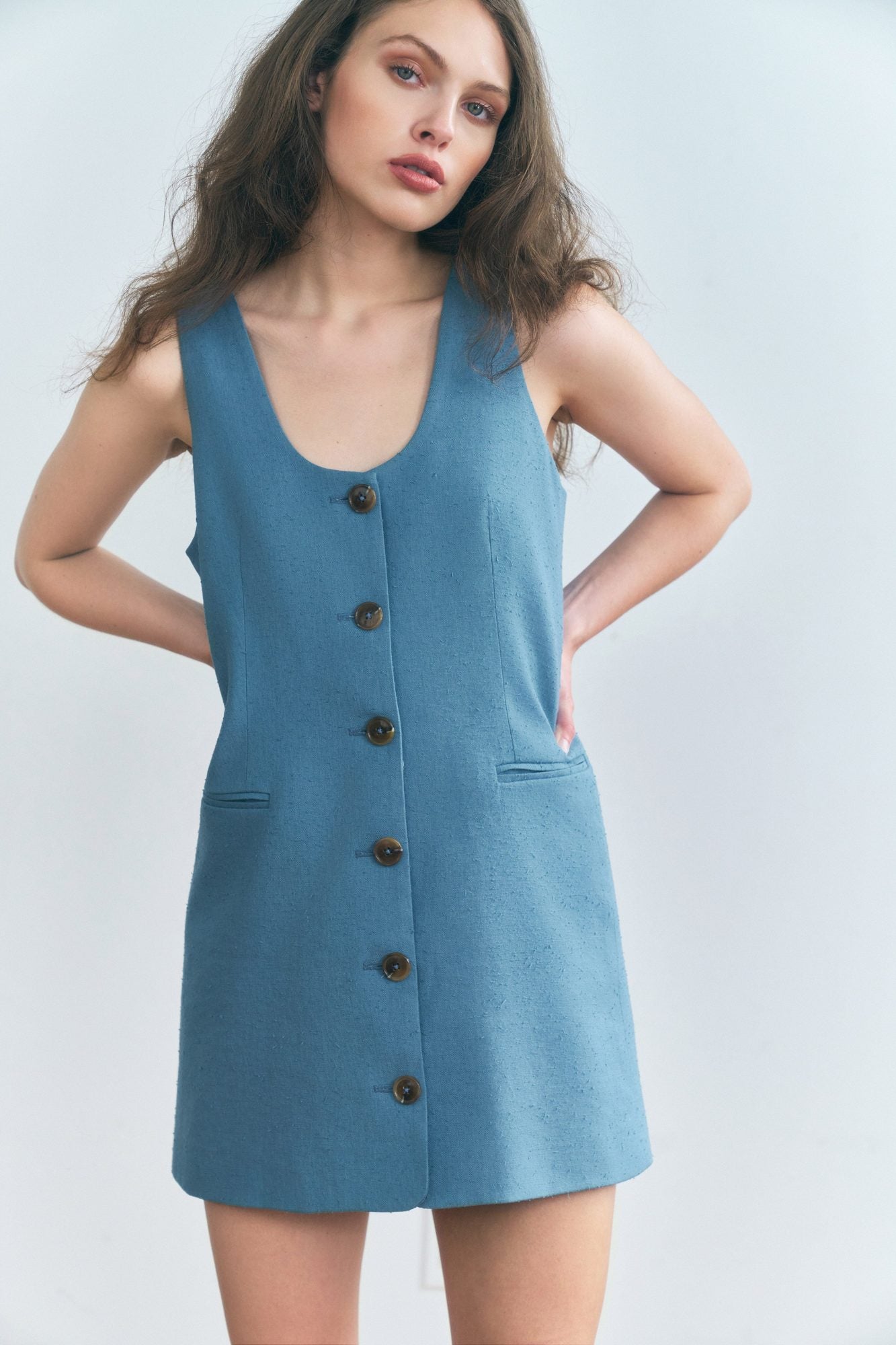 Stathe Malva Dress in 70's Blue — sleeveless button-front mini, front view