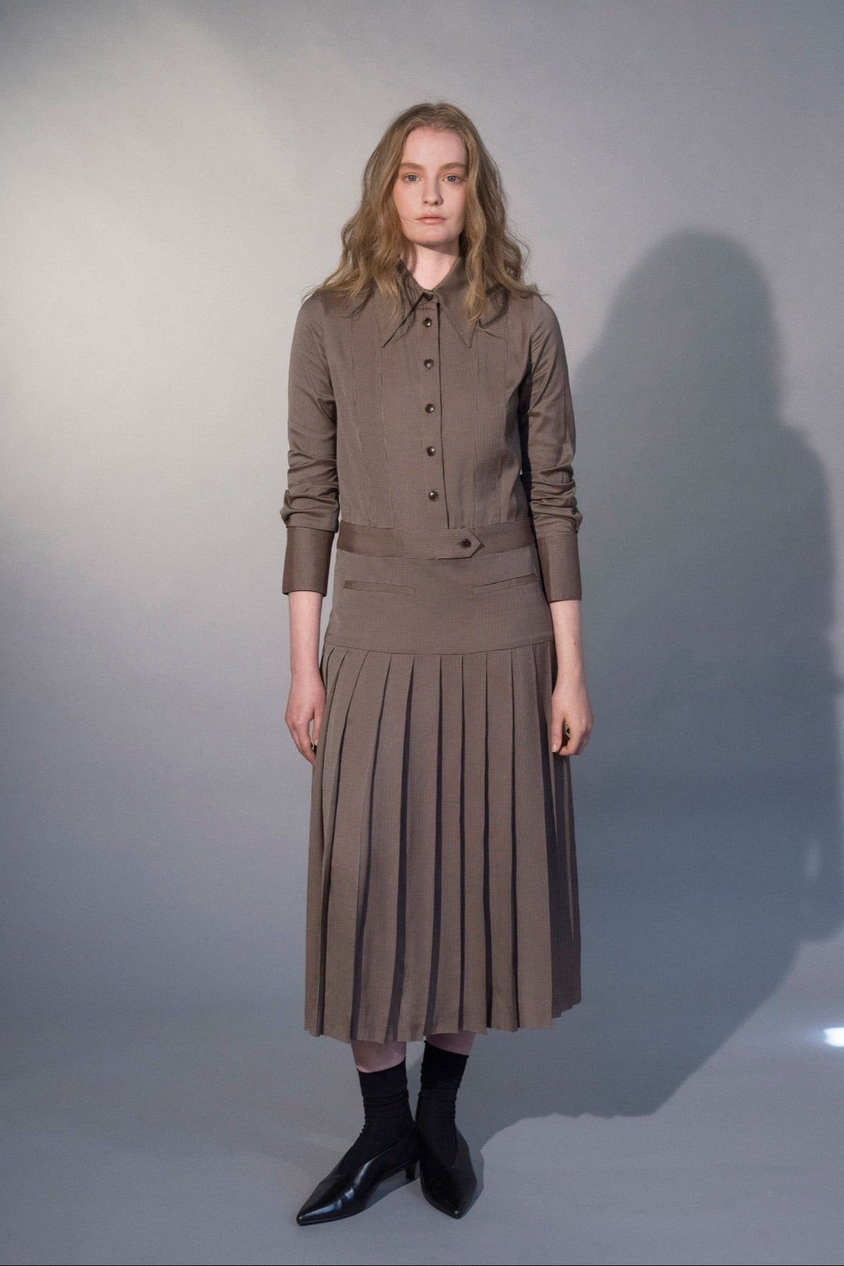 Stathe Mezquite Dress in Mushroom — pointed collar, dropped waist, pleated skirt, front view