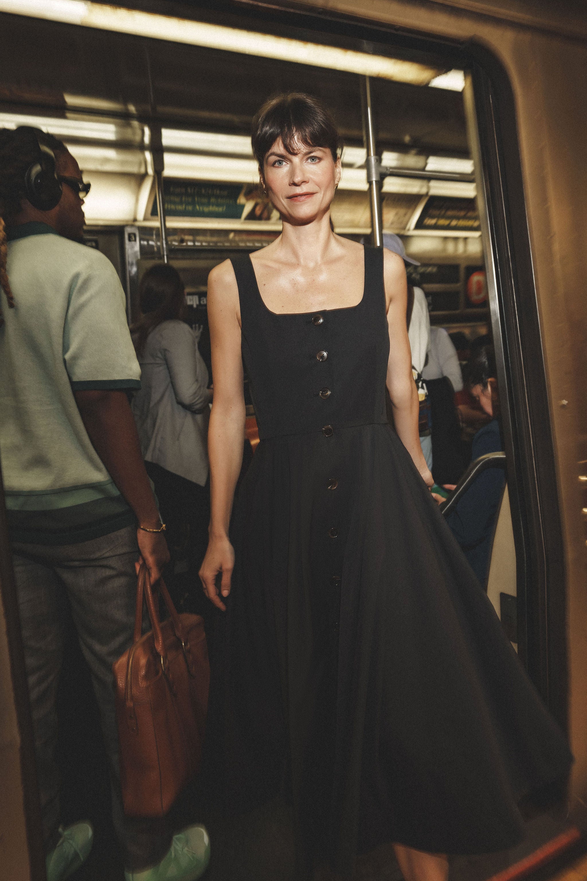 Ocotillo dress in Black — cotton blend, button-front closure, emphasizes natural waist, above-ankle length, hidden pockets, lifestyle editorial