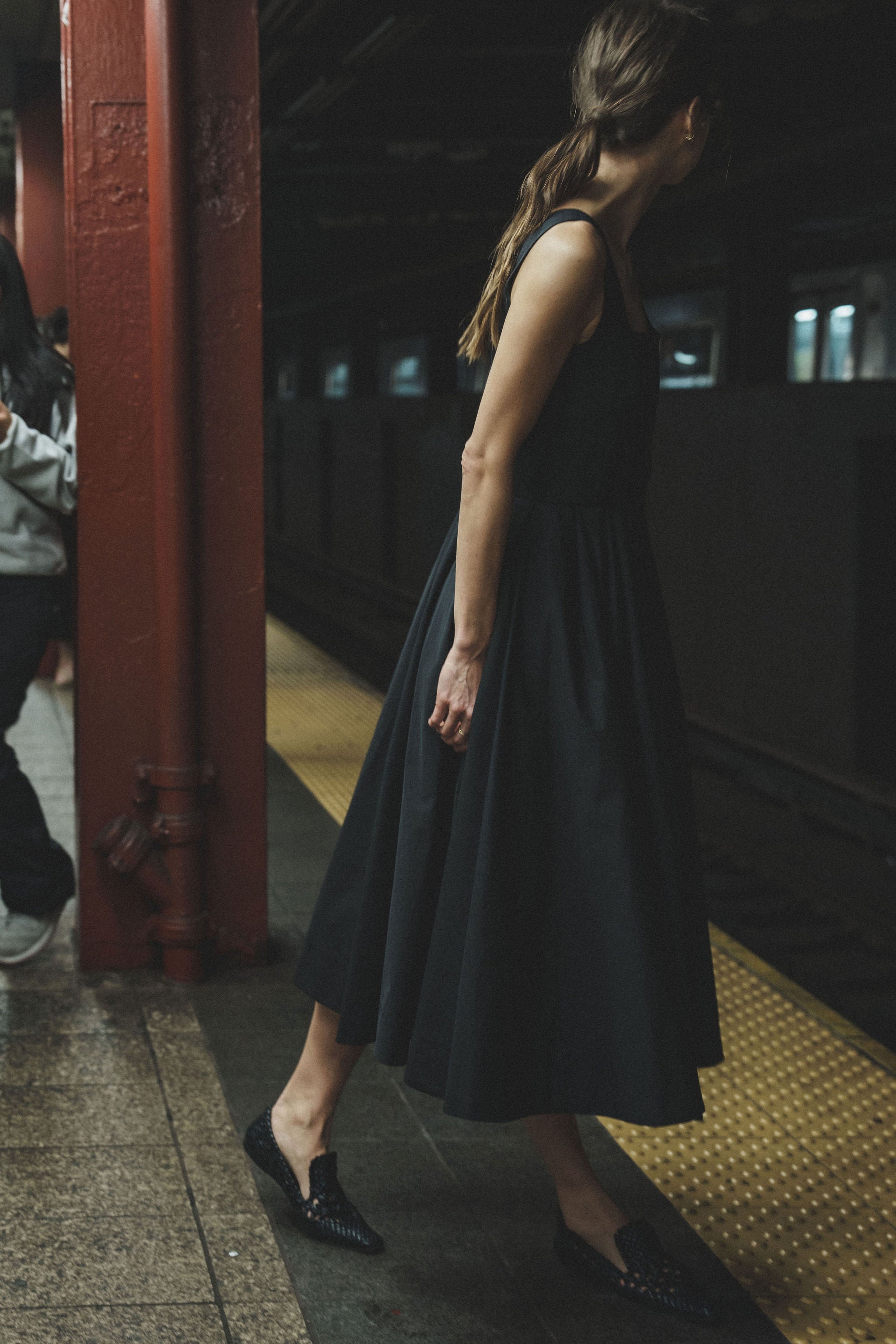 Ocotillo dress in Black — cotton blend, button-front closure, emphasizes natural waist, above-ankle length, hidden pockets, side view