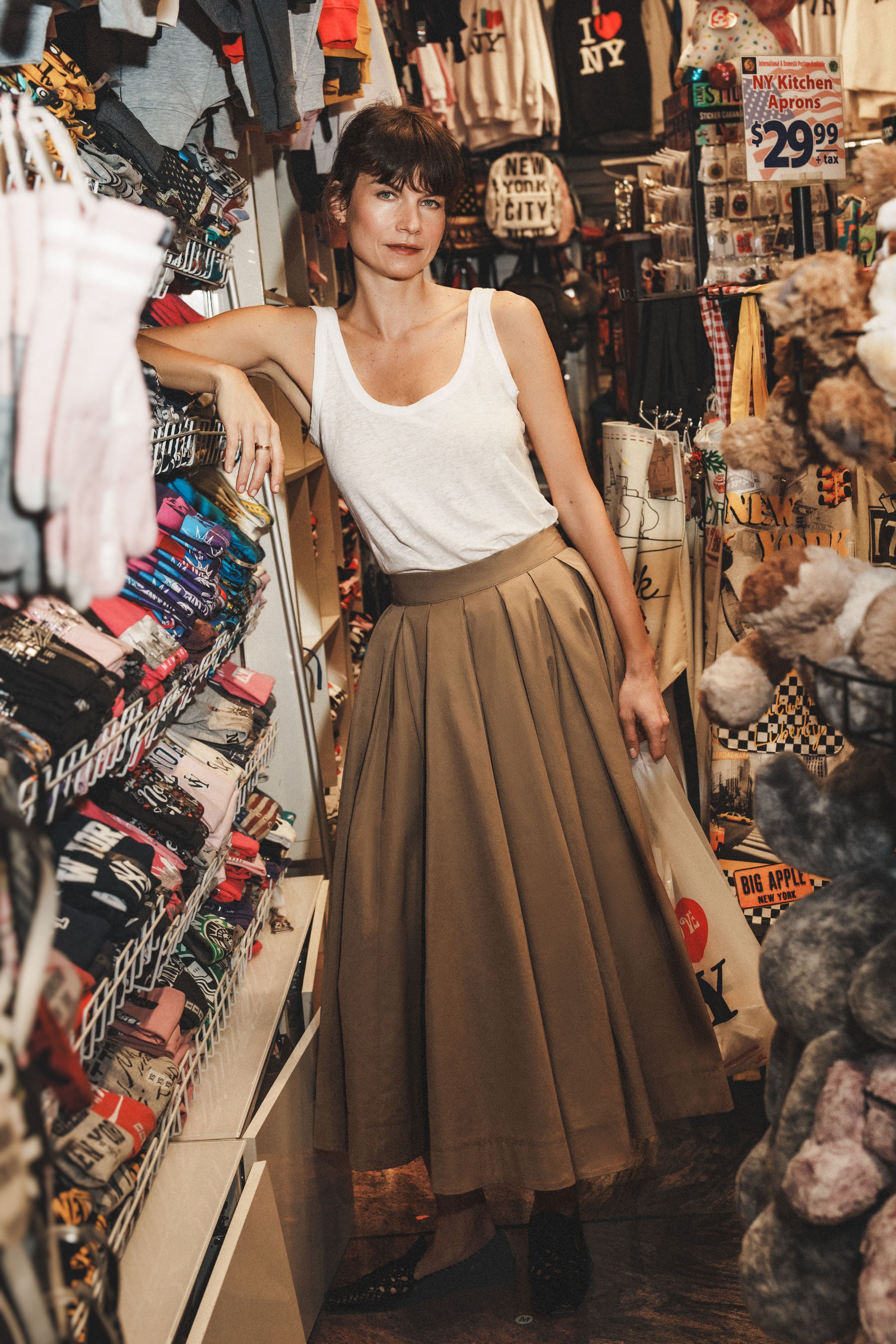 Palofierro skirt in Trench — crisp mid-weight Japanese cotton, natural waist, above-ankle length, continuous movement, hidden side pockets, concealed back-zip and button closure 