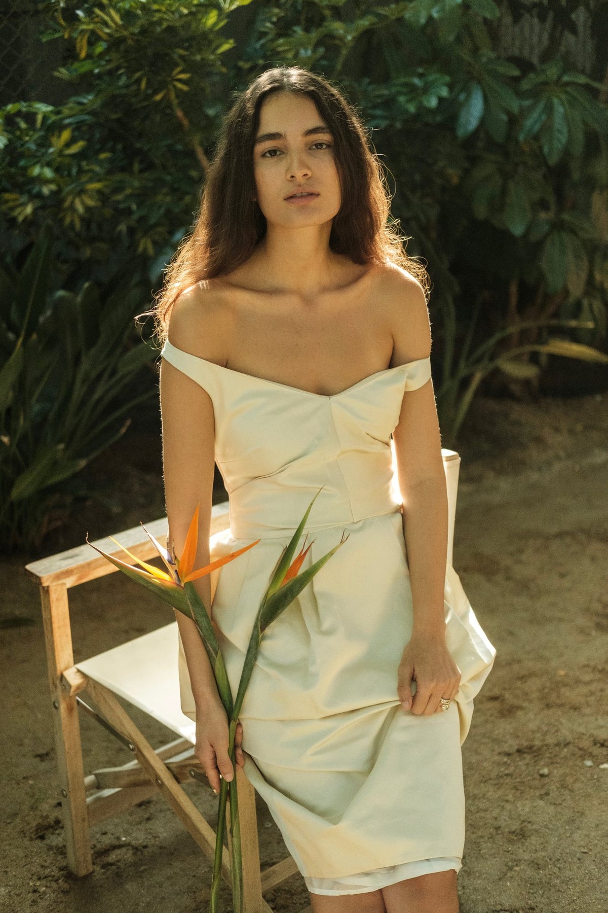 Woman wearing the Stathe Piloncillo Dress in Butter, outdoors — editorial