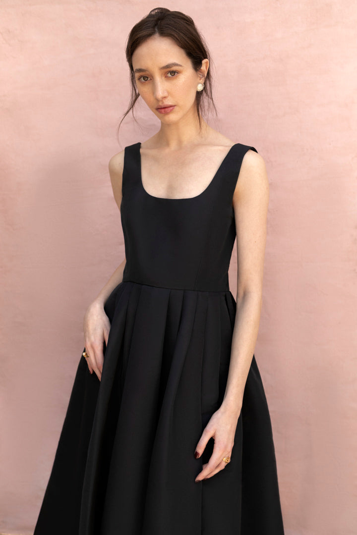 Pitahaya dress in Black — faille fabric, cowl back detail, full skirt above-ankle length, self-lined bodice, fully silk-lined skirt, hidden pockets, concealed side zip