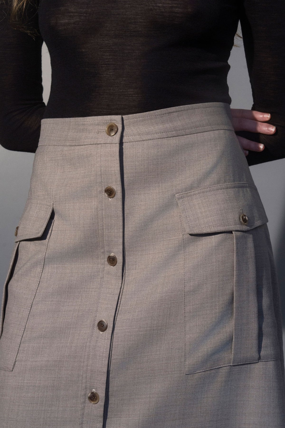 Stathe Samota Skirt in Oatmeal — pocket and button detail