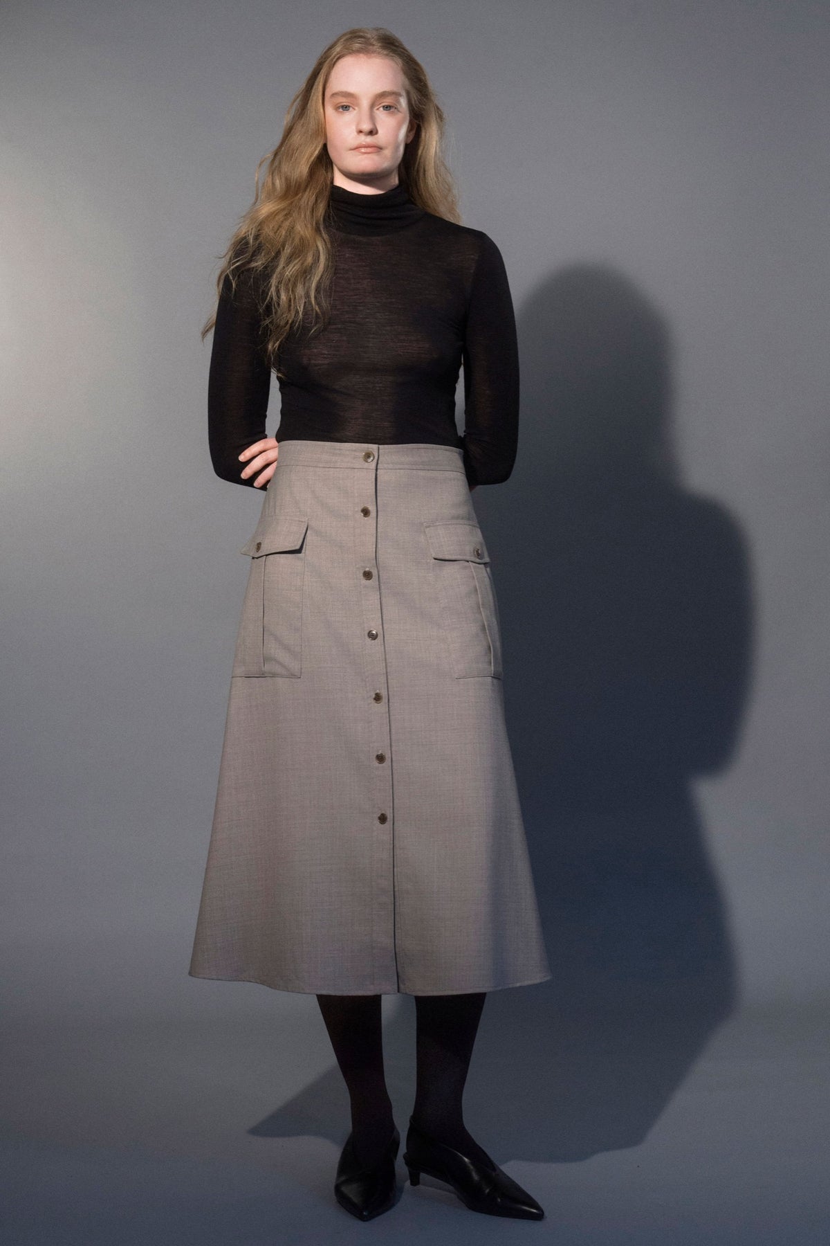 Stathe Samota Skirt in Oatmeal — A-line, button front, flap pockets, front view