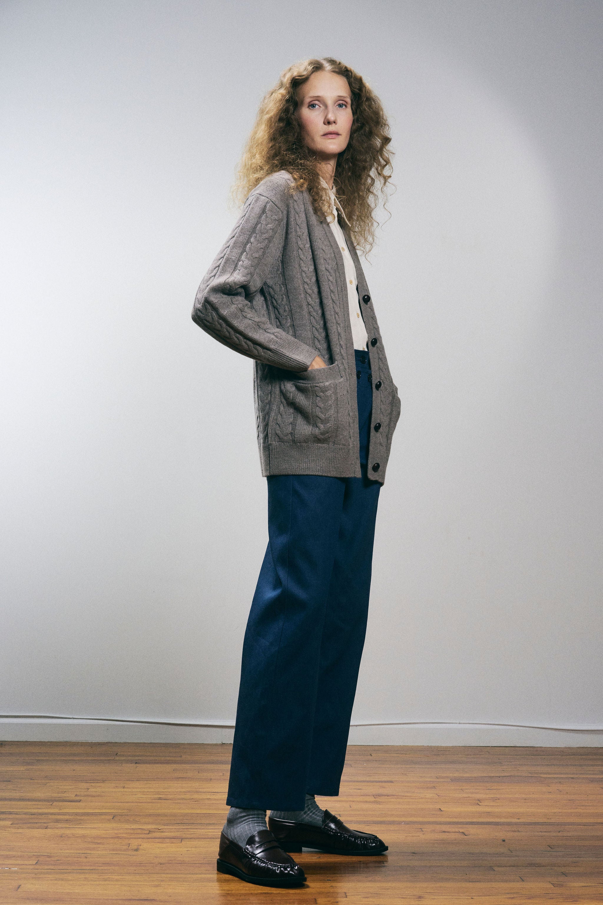 Sanmiguelito cardigan in Heather Brown — 100% Extrafine Merino wool, horseshoe cable and rib knit pattern, dropped shoulder, ribbed cuffs and hem, dark brown leather buttons, below-waist length, fabric closeup