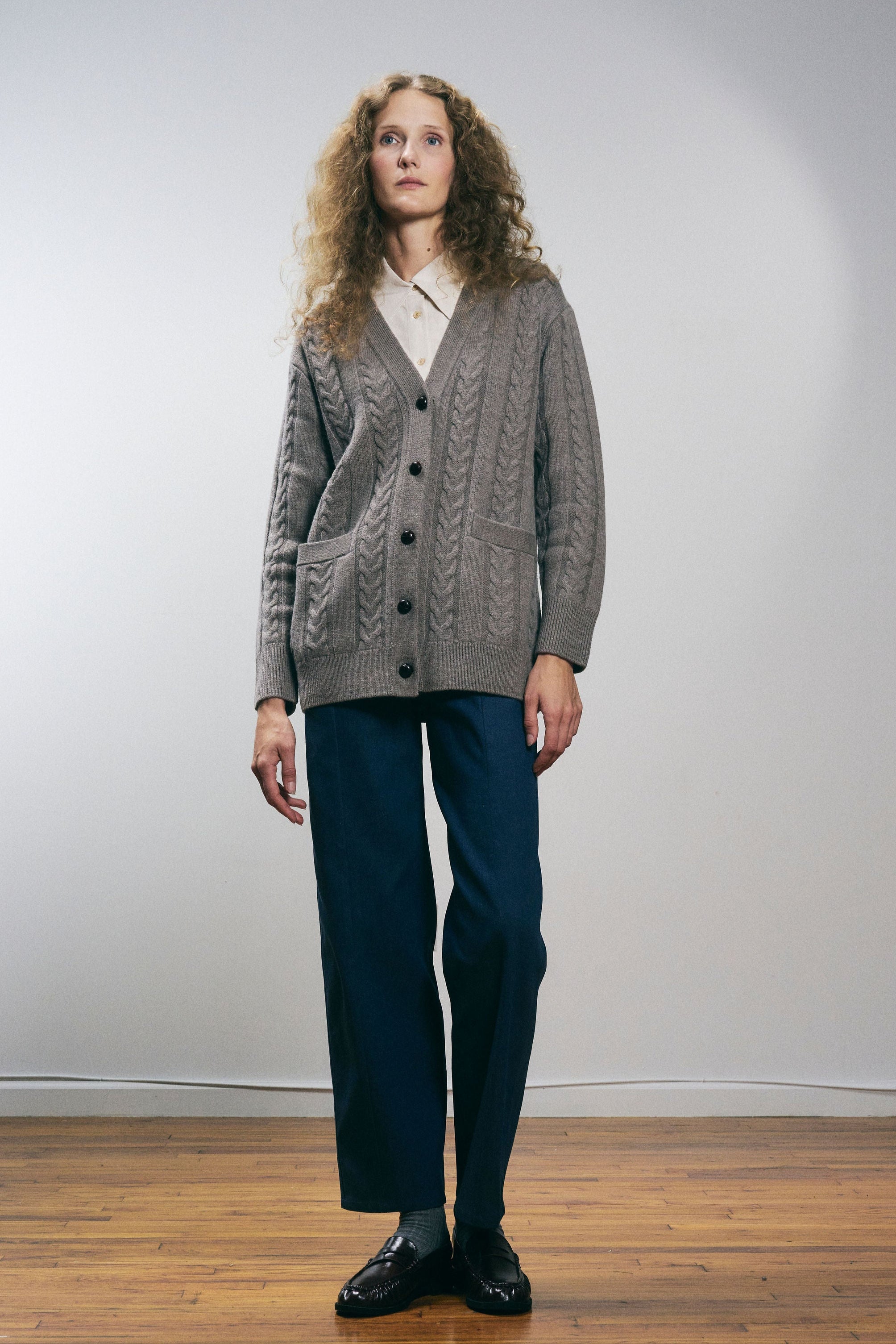 Sanmiguelito cardigan in Heather Brown — 100% Extrafine Merino wool, horseshoe cable and rib knit pattern, dropped shoulder, ribbed cuffs and hem, dark brown leather buttons, below-waist length, alternate front view