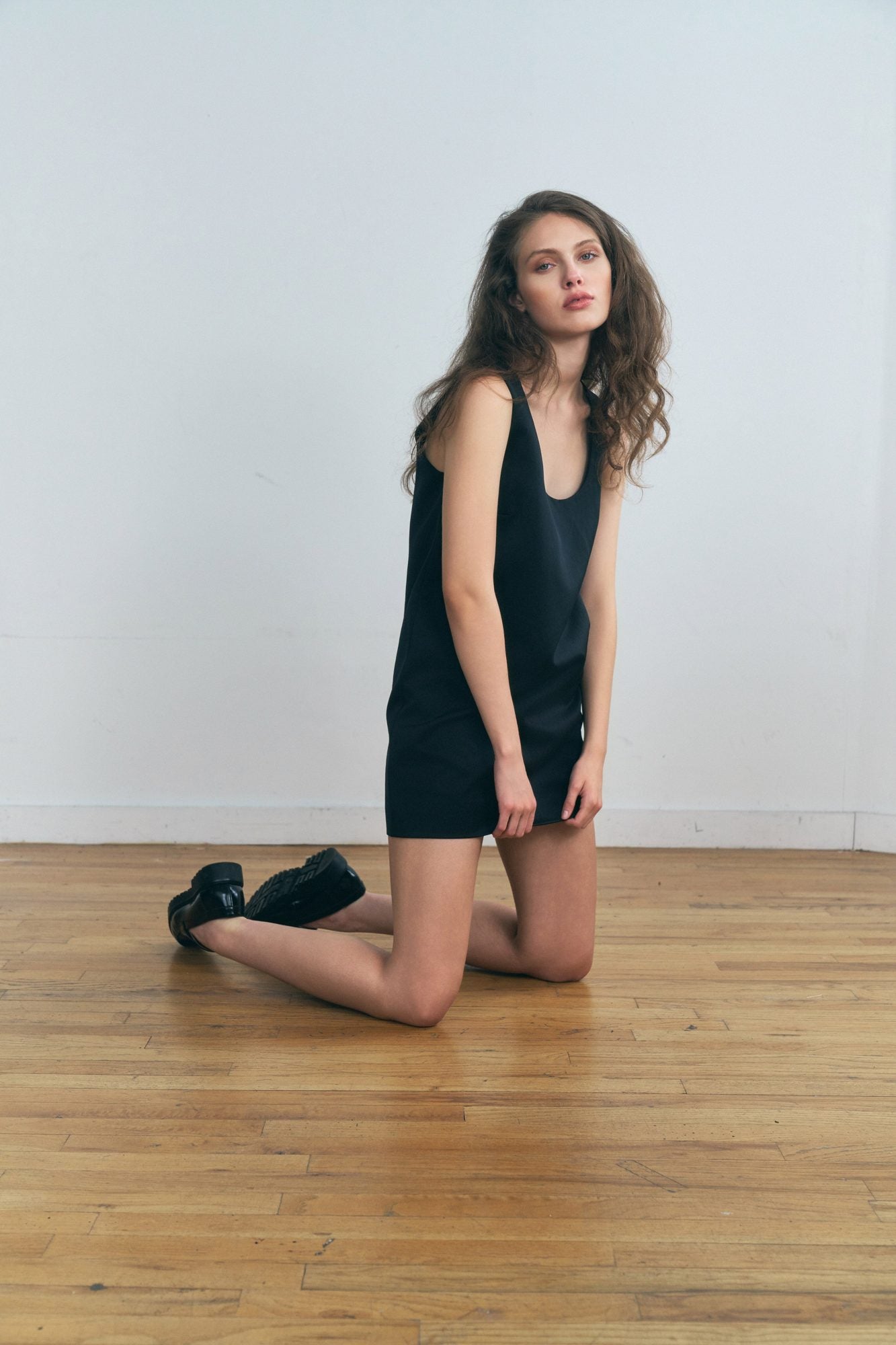 Woman wearing the Stathe Tabachin Minidress in Black — editorial