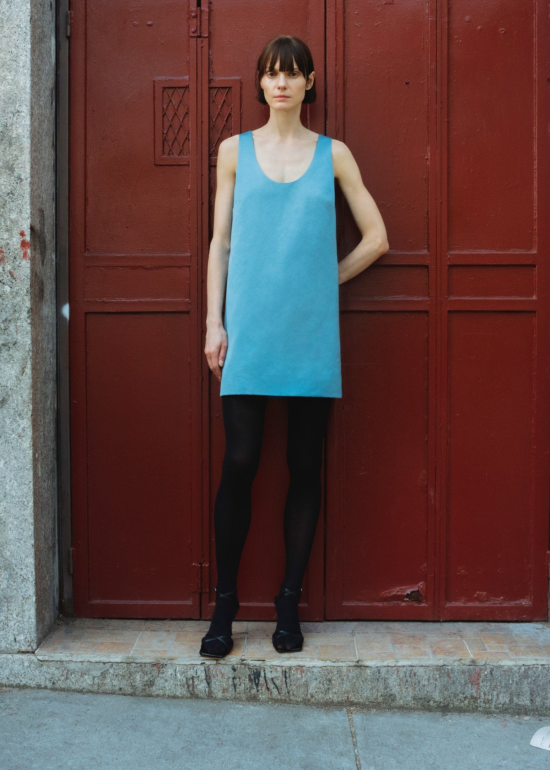 Tabachin minidress in Cerulean — Italian duchesse satin, structured straight column silhouette, deep round décolleté, side zip closure