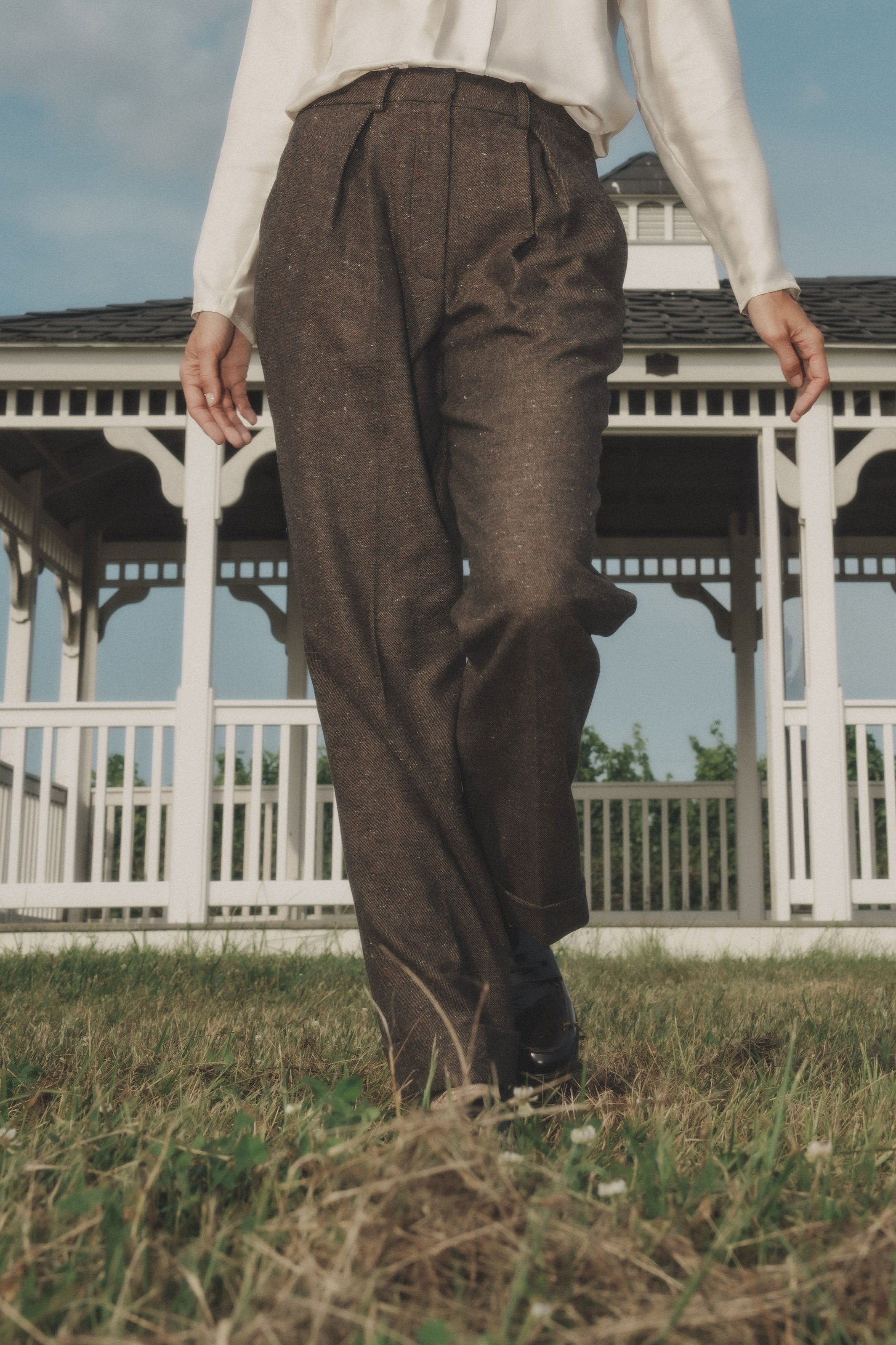Torote Pants in Speckled Truffle — Japanese lightweight wool viscose, speckled tweed texture, 50's-inspired pleated silhouette, slightly tapered, cuffed hem, front hook and zip closure, side view